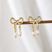 Sphere&Style Stylish Pearly Bow Drop Earrings
